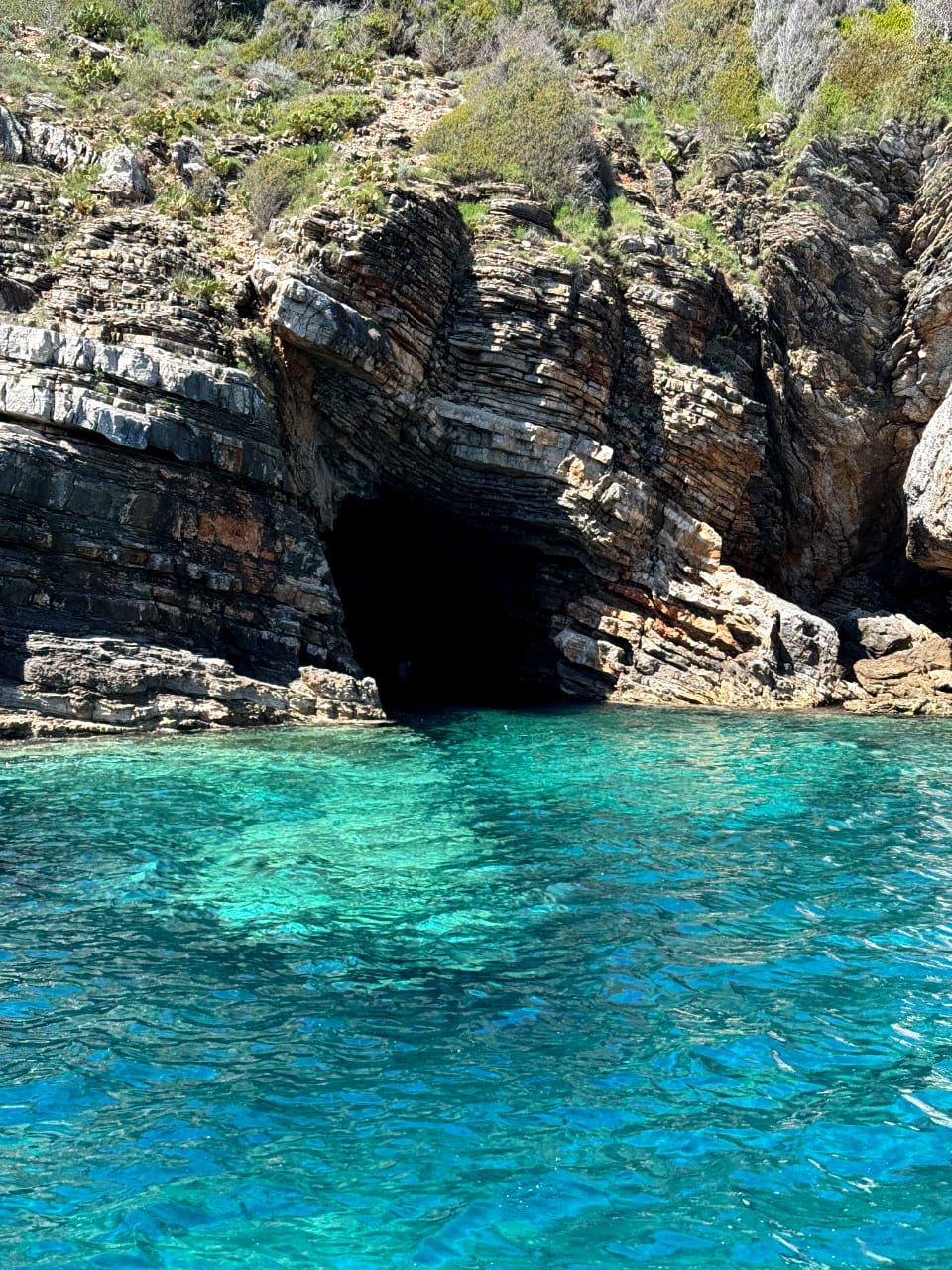 Hidden sea cave with turquoise Adriatic water in Montenegro