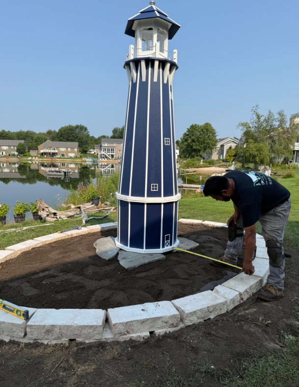 Premium West Michigan residential landscaping with patio, walkway, retaining wall, and landscape beds