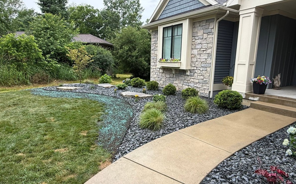 Hydroseeded lawn area integrated with landscape beds in West Michigan