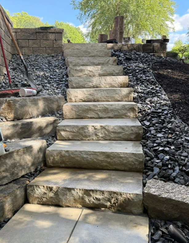 Walkway with surrounding mulch and landscape beds in a West Michigan yard