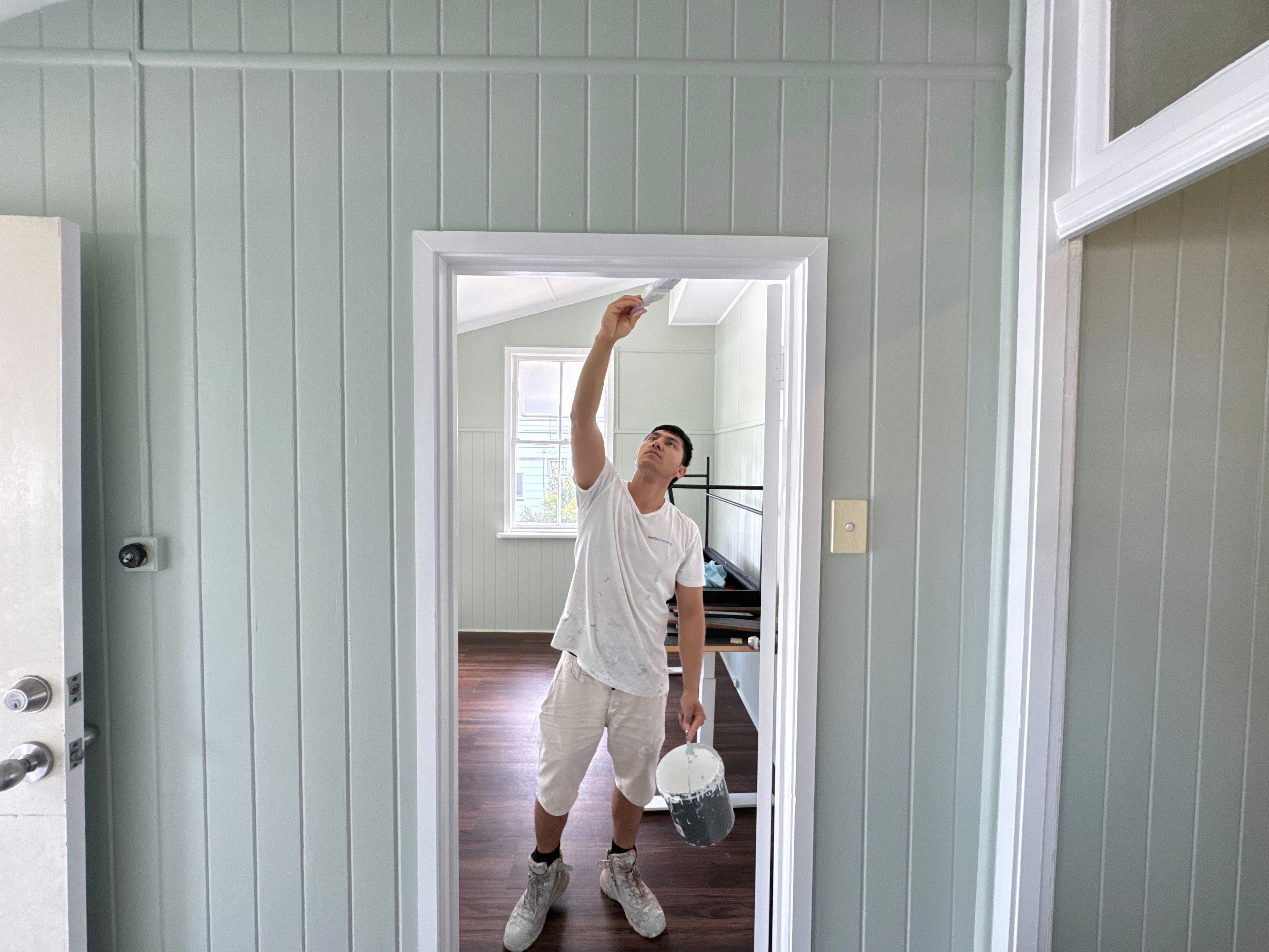 Perfex Painting crew at work — freshly painted Queenslander interior