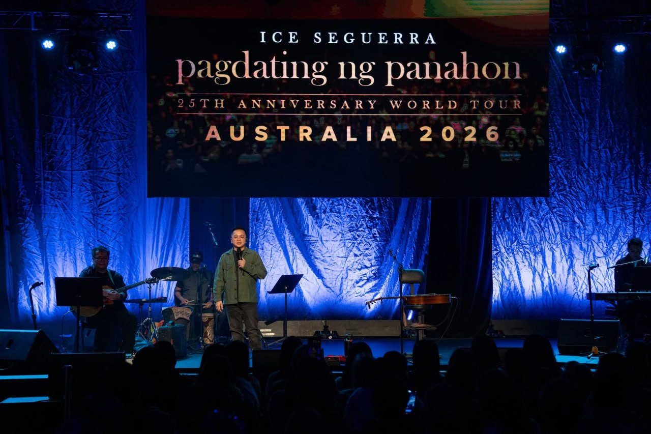 Ice Seguerra and his live band performing on the grand stage beneath the Pagdating ng Panahon 25th Anniversary World Tour Australia 2026 backdrop washed in deep cobalt blue.