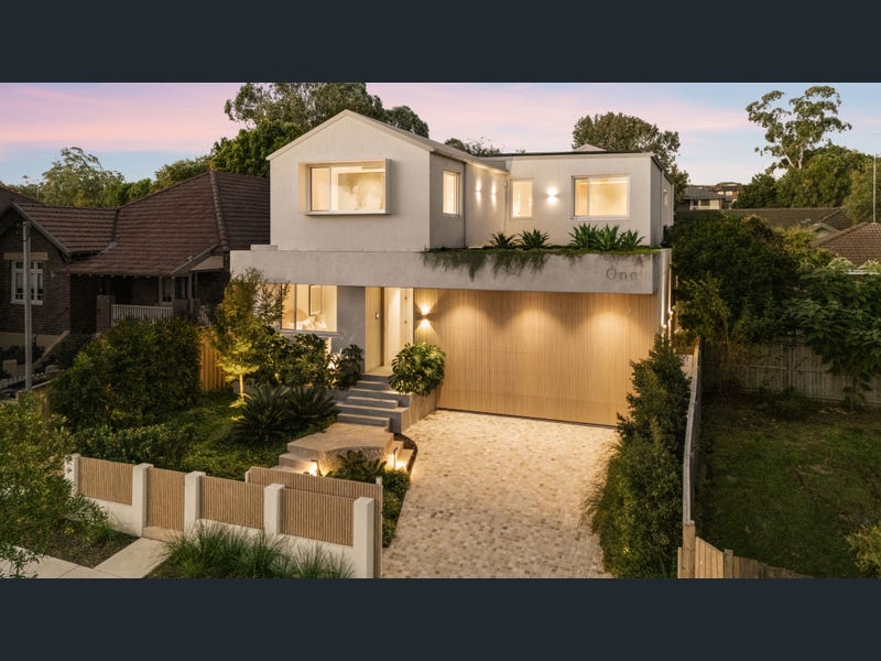 Modern Lane Cove home with landscaped garden and driveway, reflecting property values in the area.