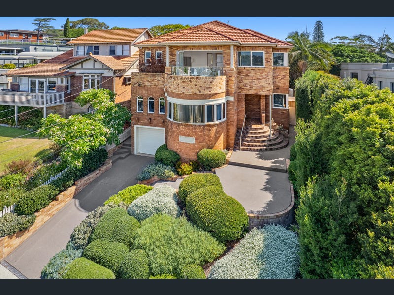 Elegant waterfront home in Drummoyne with harbour views and manicured gardens.
