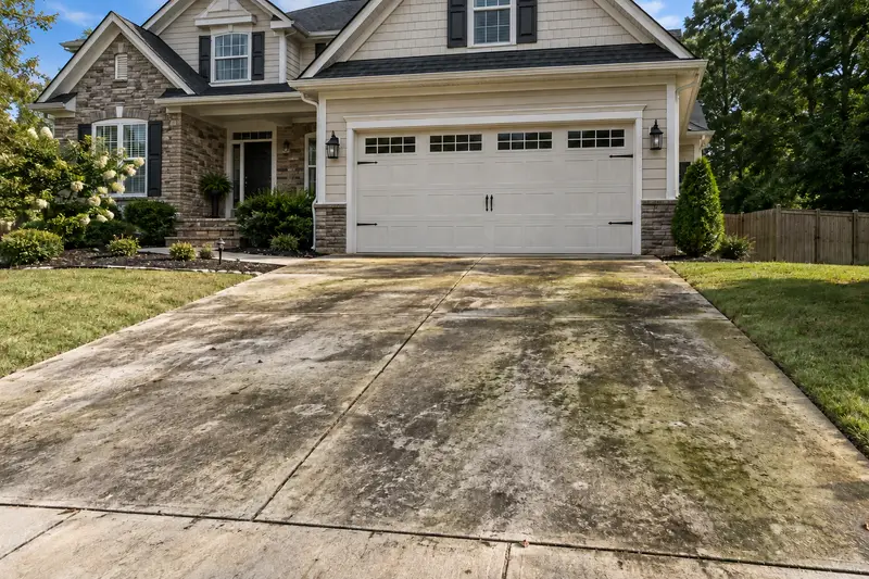 Driveway concrete before pressure washing