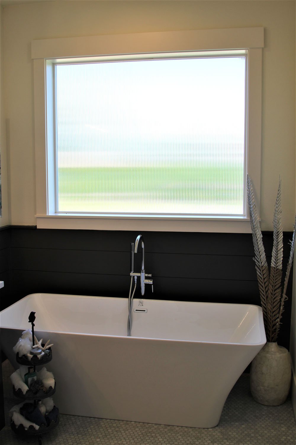 Residential window installation with reeded glass in bathroom