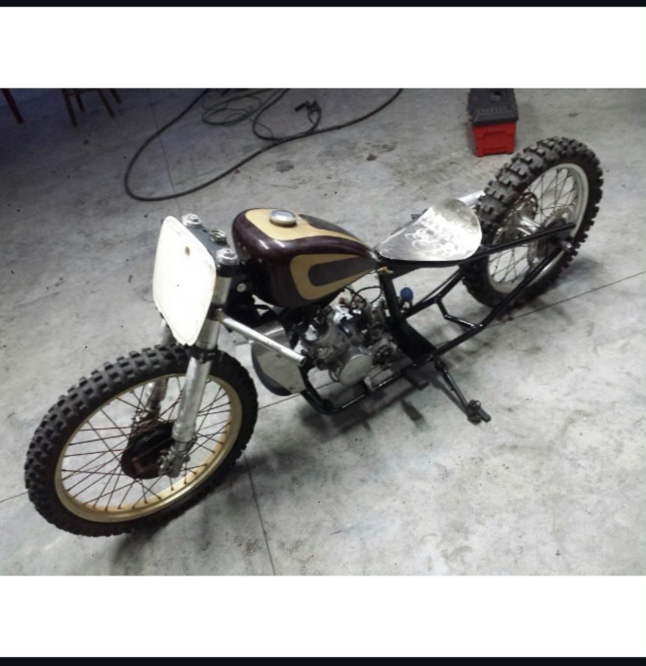 Vintage dirt bike custom build with cream and brown tank by Marlito Motorcycles workshop
