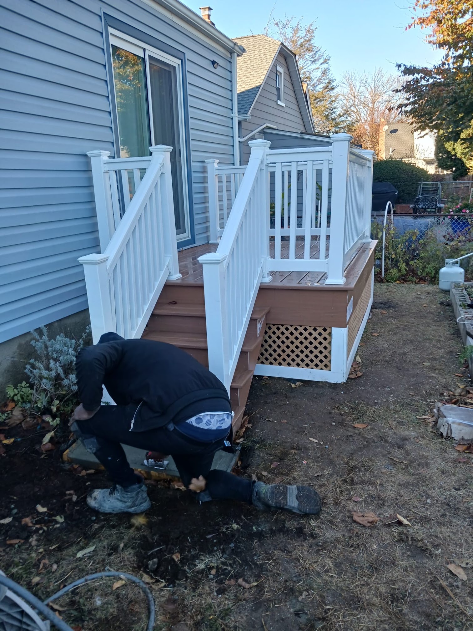 Custom Composite & Wood Decks project by Dougy Construction in Valley Stream, NY