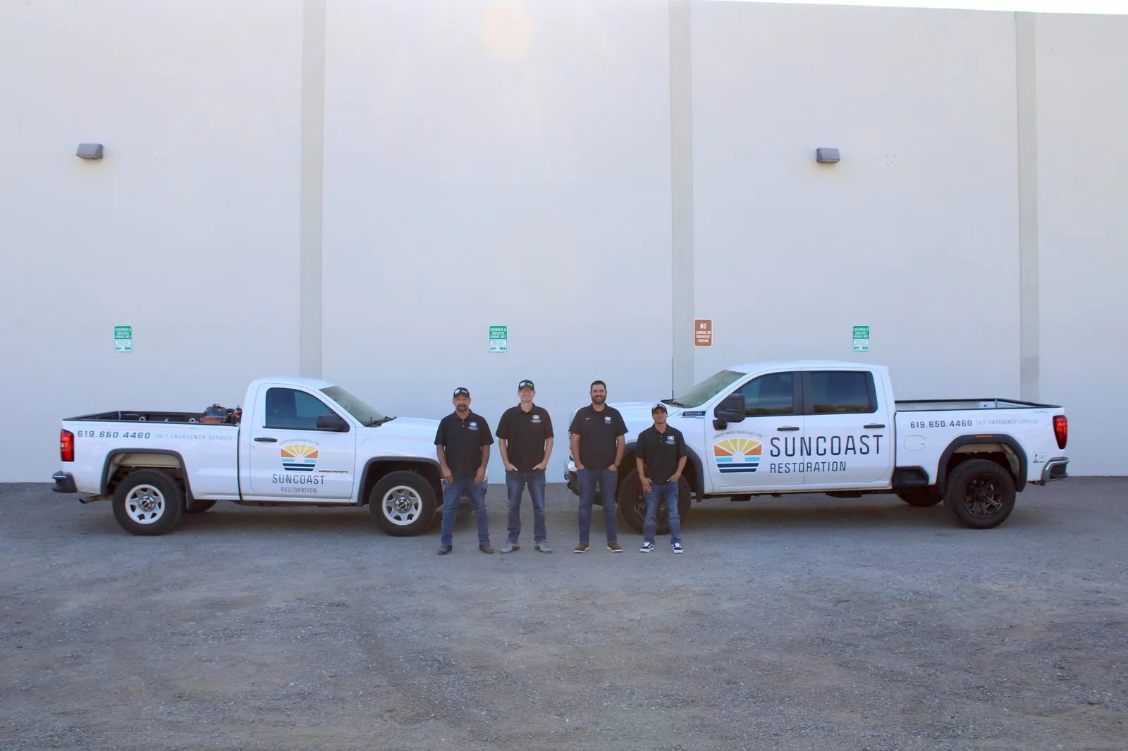 SunCoast Restoration team with branded restoration trucks
