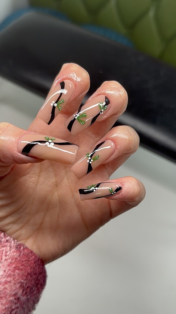 Black and white abstract line art with green leaf accents