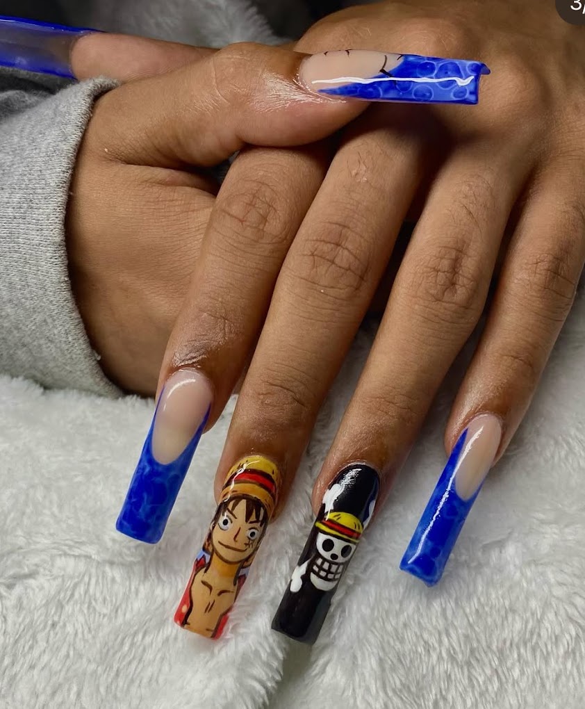 Custom anime character nail art with blue French tips