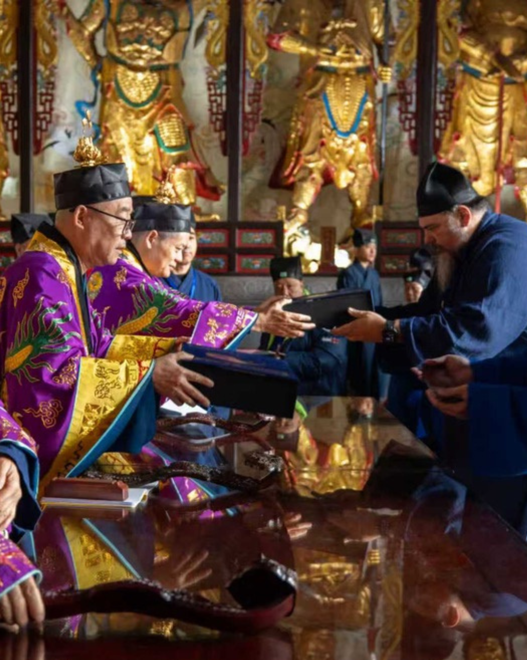 Diego practicing — Daoist ceremony inside a traditional temple