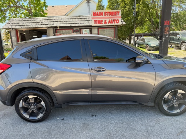 Gray SUV with professionally tinted windows by Tinted by TK in Bloomington IL