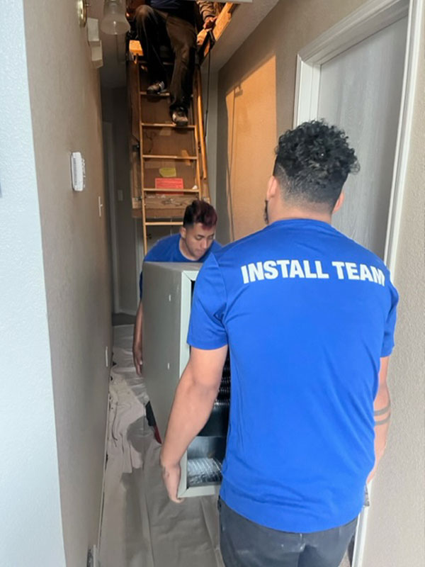 Service Champs installing a new high-efficiency AC condenser unit