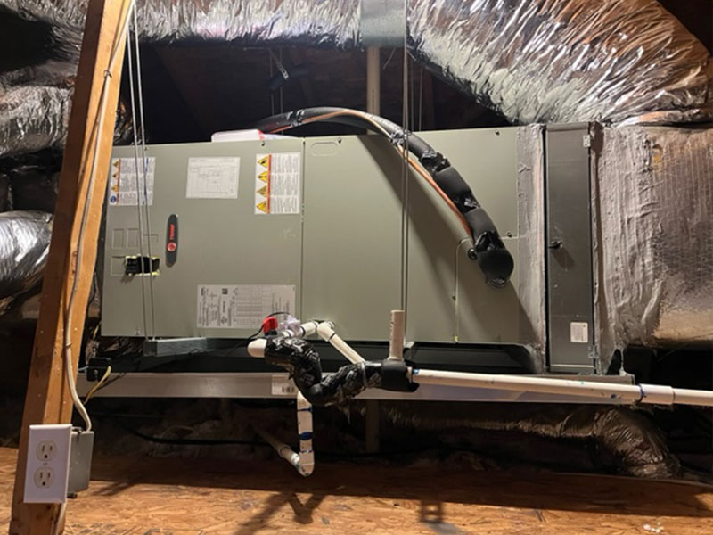 Service Champs technician inspecting rooftop commercial HVAC unit
