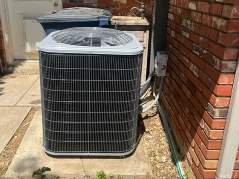 Service Champs technician servicing indoor ductwork and air handler