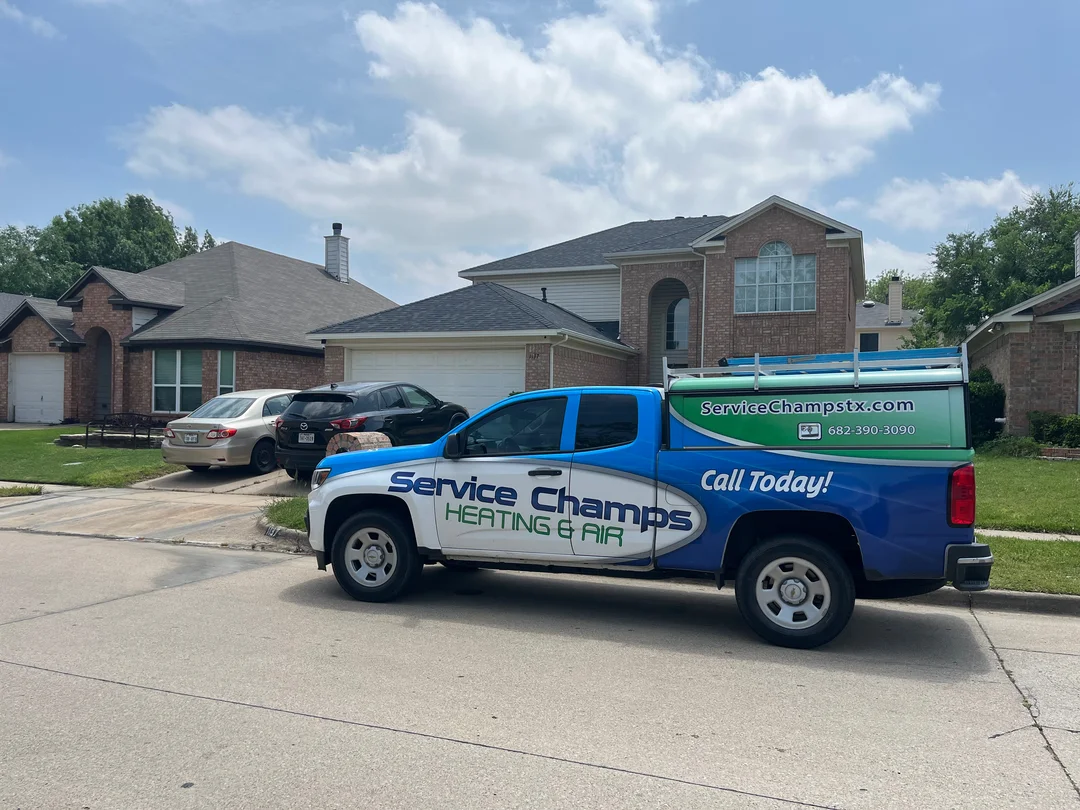 Service Champs branded truck parked in a Tarrant County neighborhood