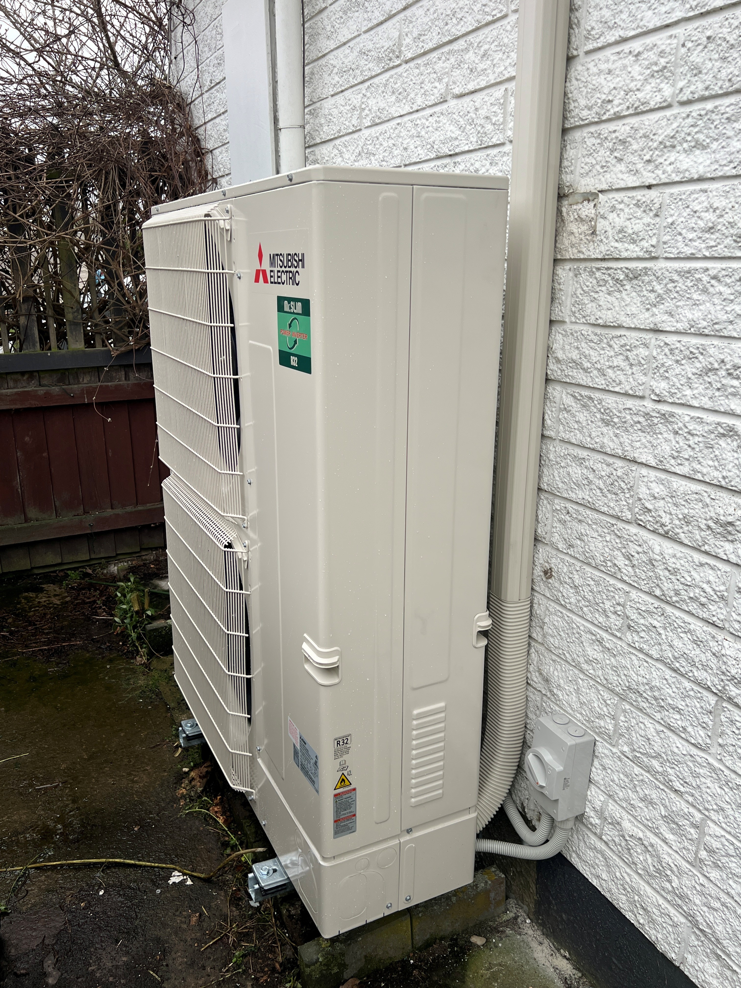 Mitsubishi Electric outdoor heat pump unit installed at the Redwood ducted heat pump upgrade project in Christchurch.