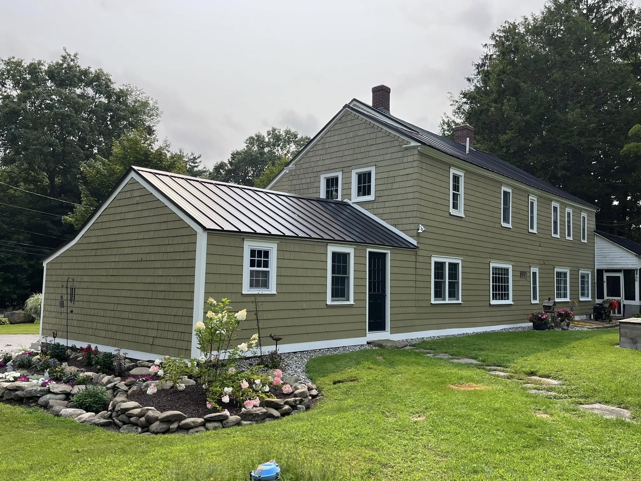 Painting project by Handy Lou's — olive shingle-style house