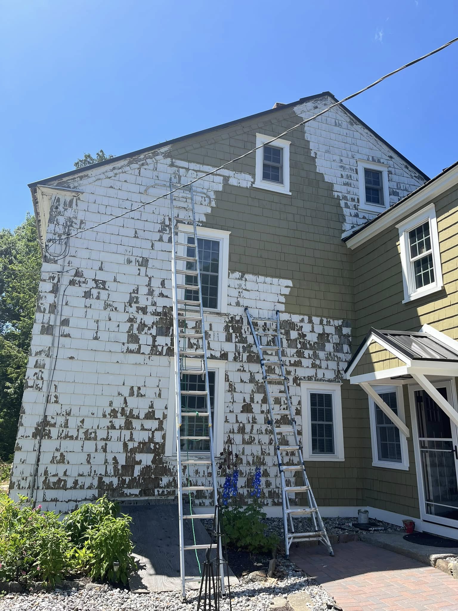 Painting project by Handy Lou's — house being prepped for paint