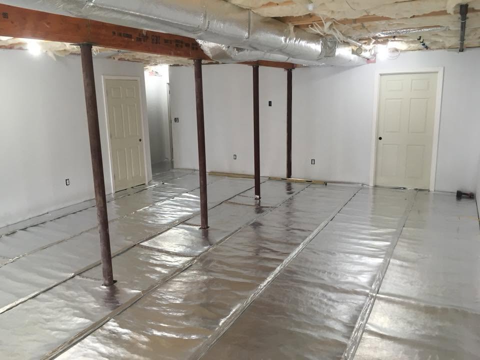 Basement finishing by Handy Lou's — before — exposed framing and studs