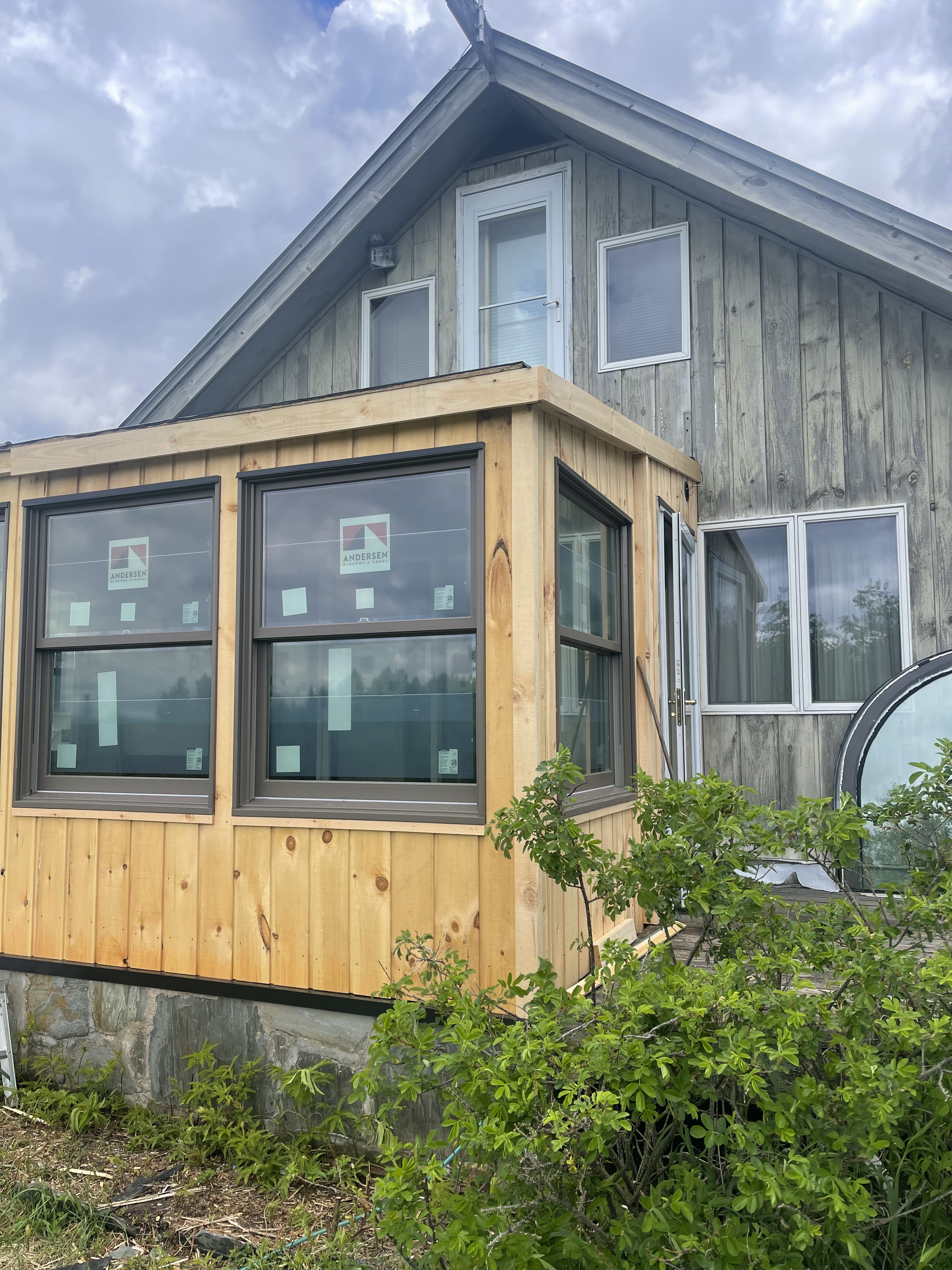 Custom wood-framed addition with Andersen windows on Vermont property