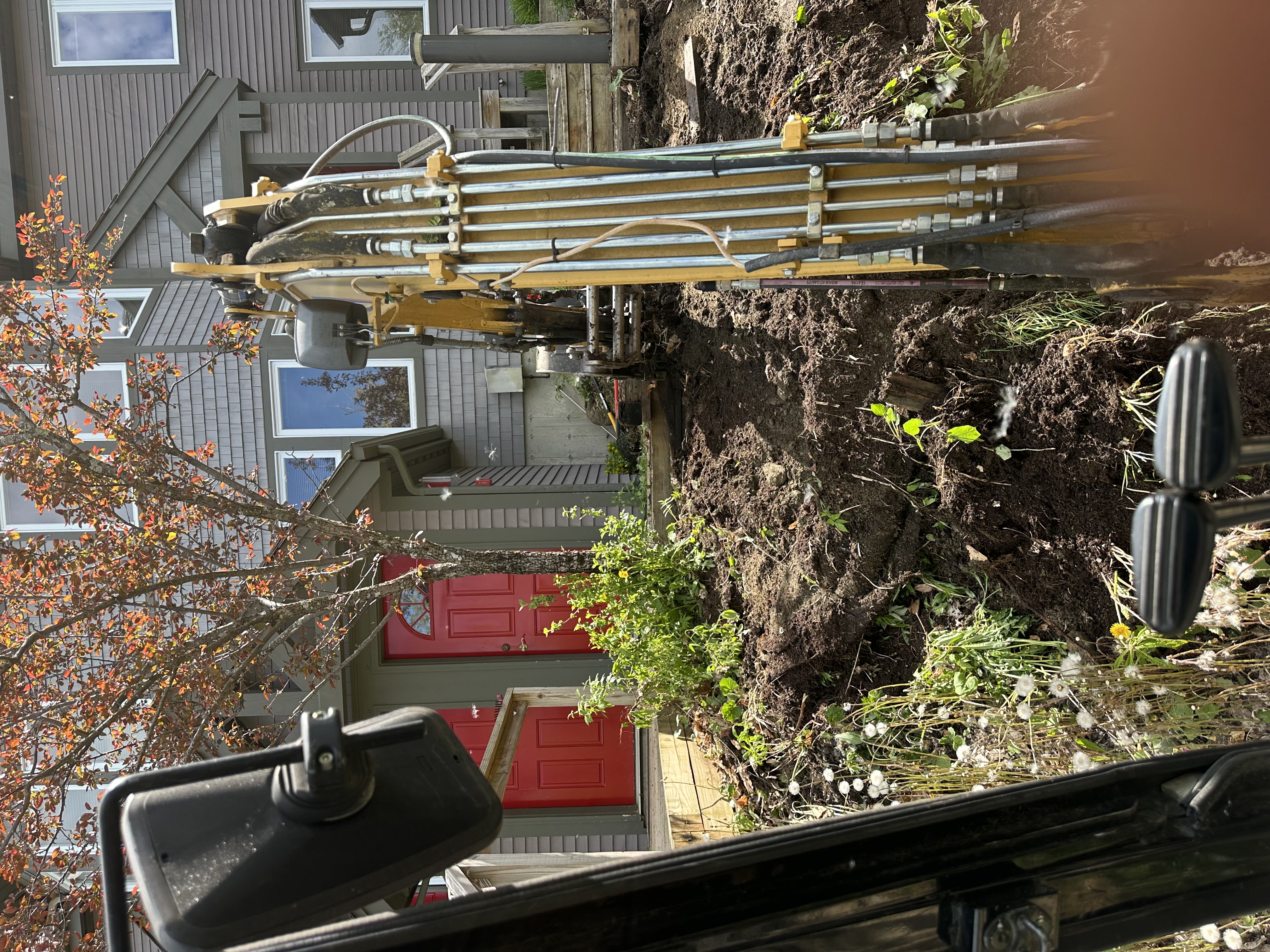 Foundation drilling equipment at residential job site in Northern Vermont
