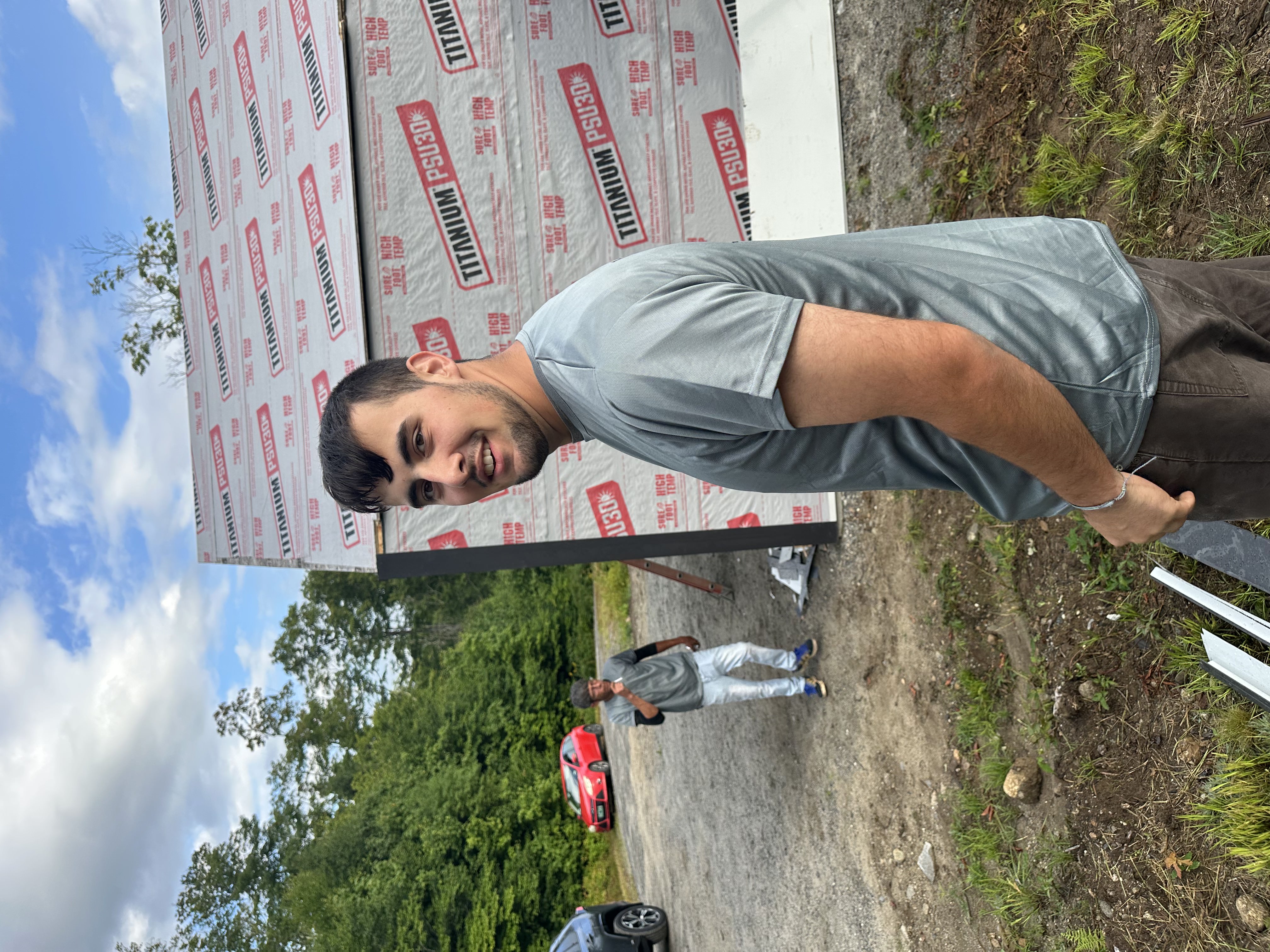 Heritage Slating team member on job site with underlayment visible