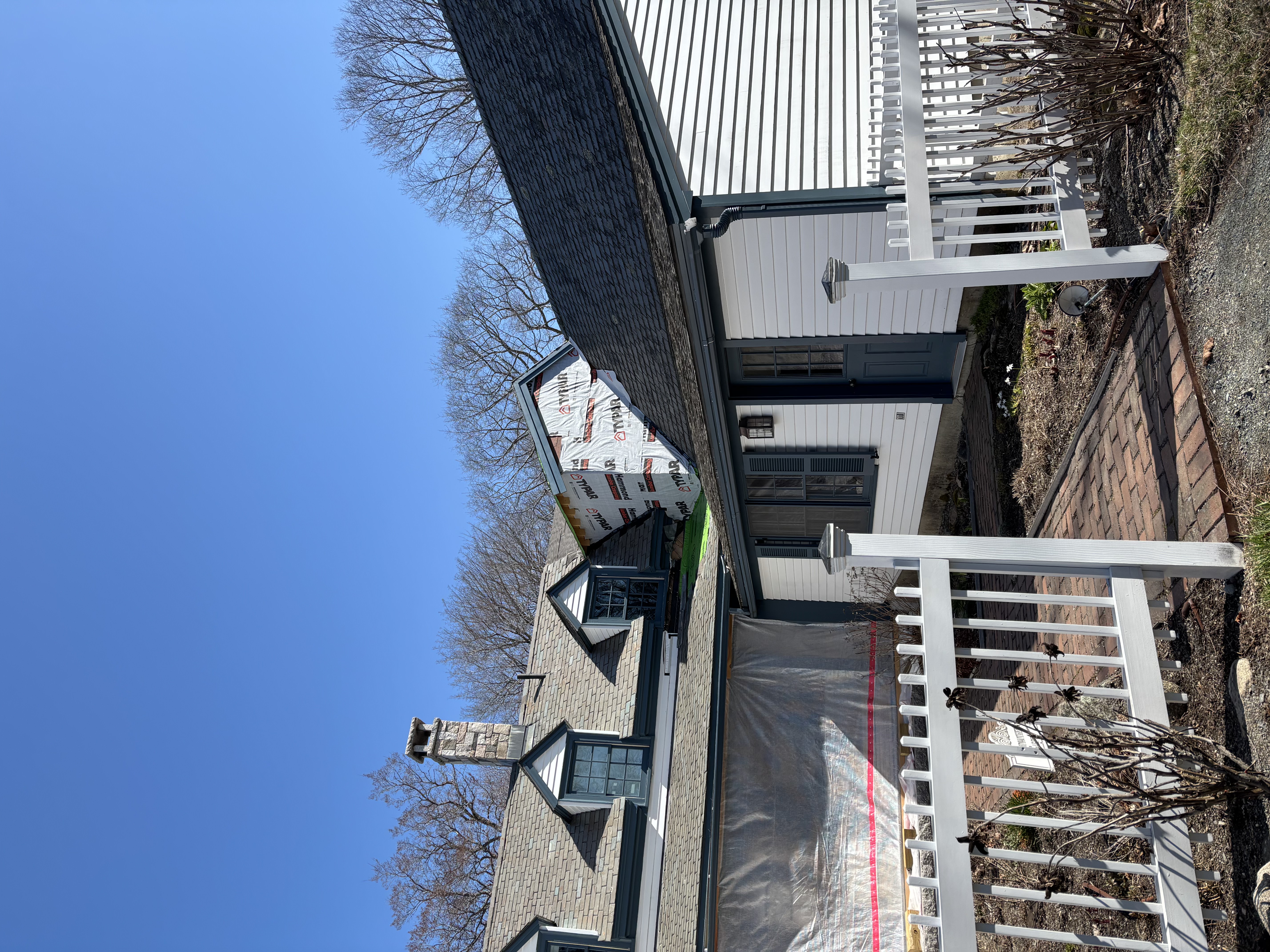 Full home renovation with slate roofing in progress