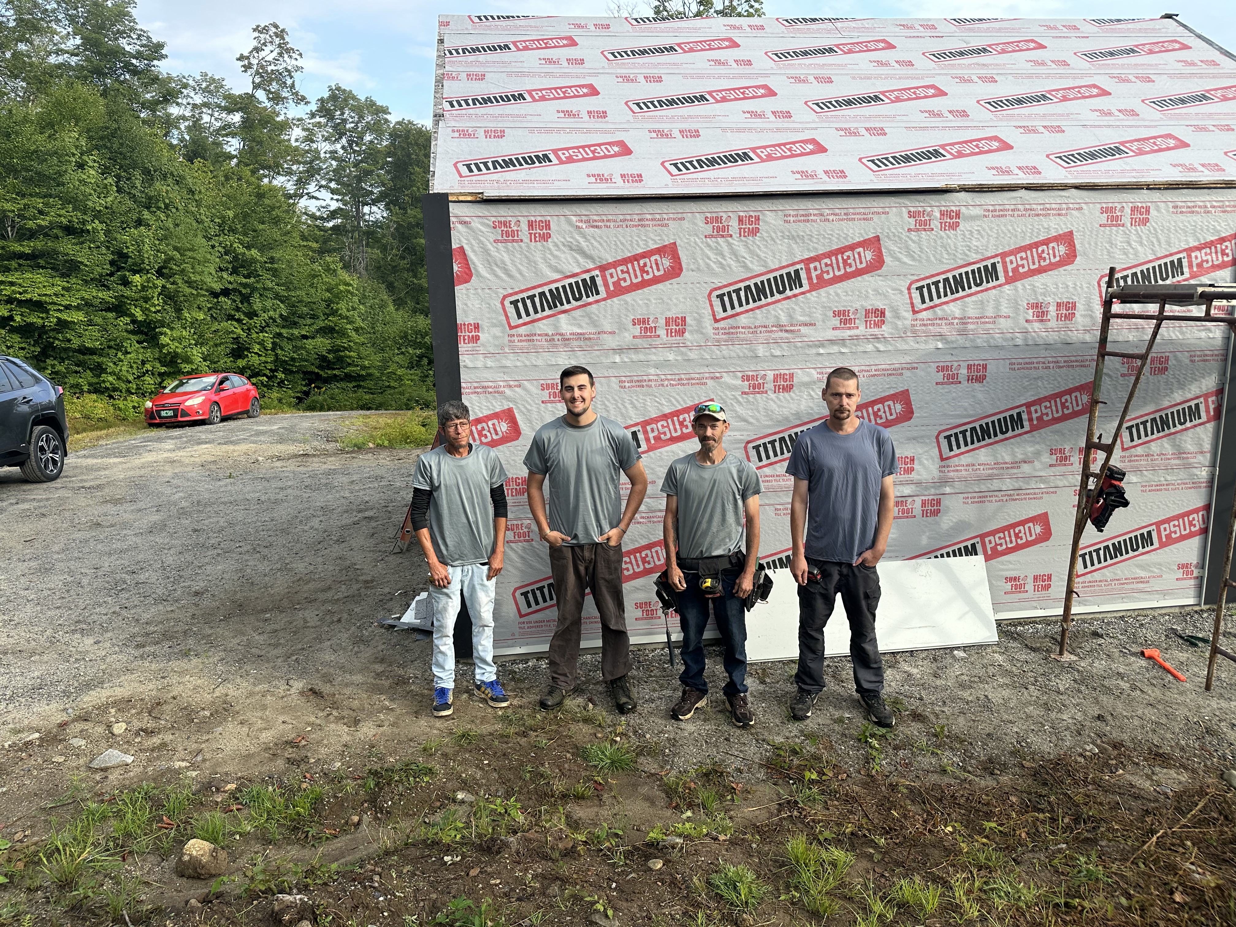 Heritage Slating full team photo in front of underlayment installation