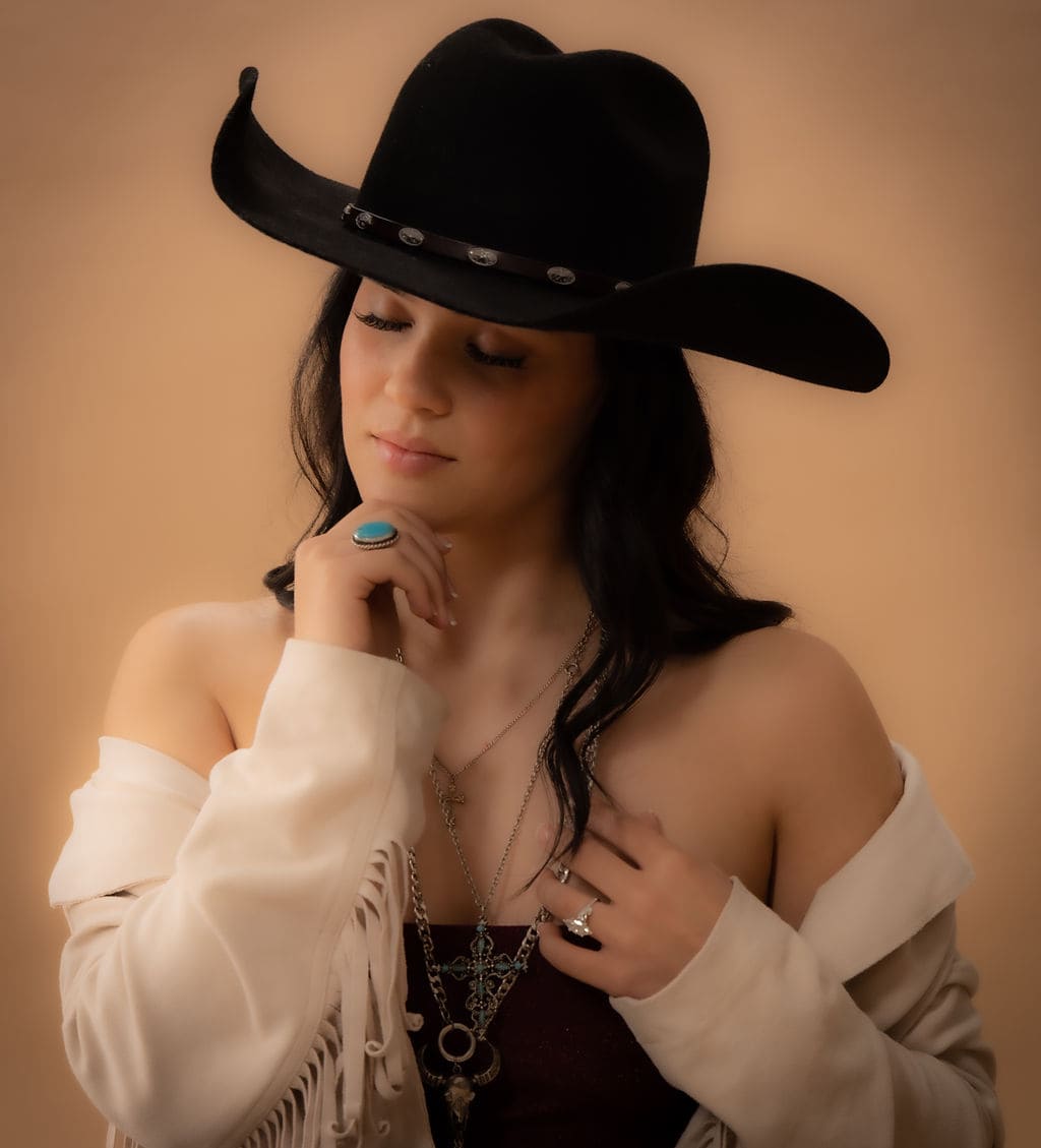 Cowgirl off-shoulder portrait with turquoise ring by Brooke Lazzarini