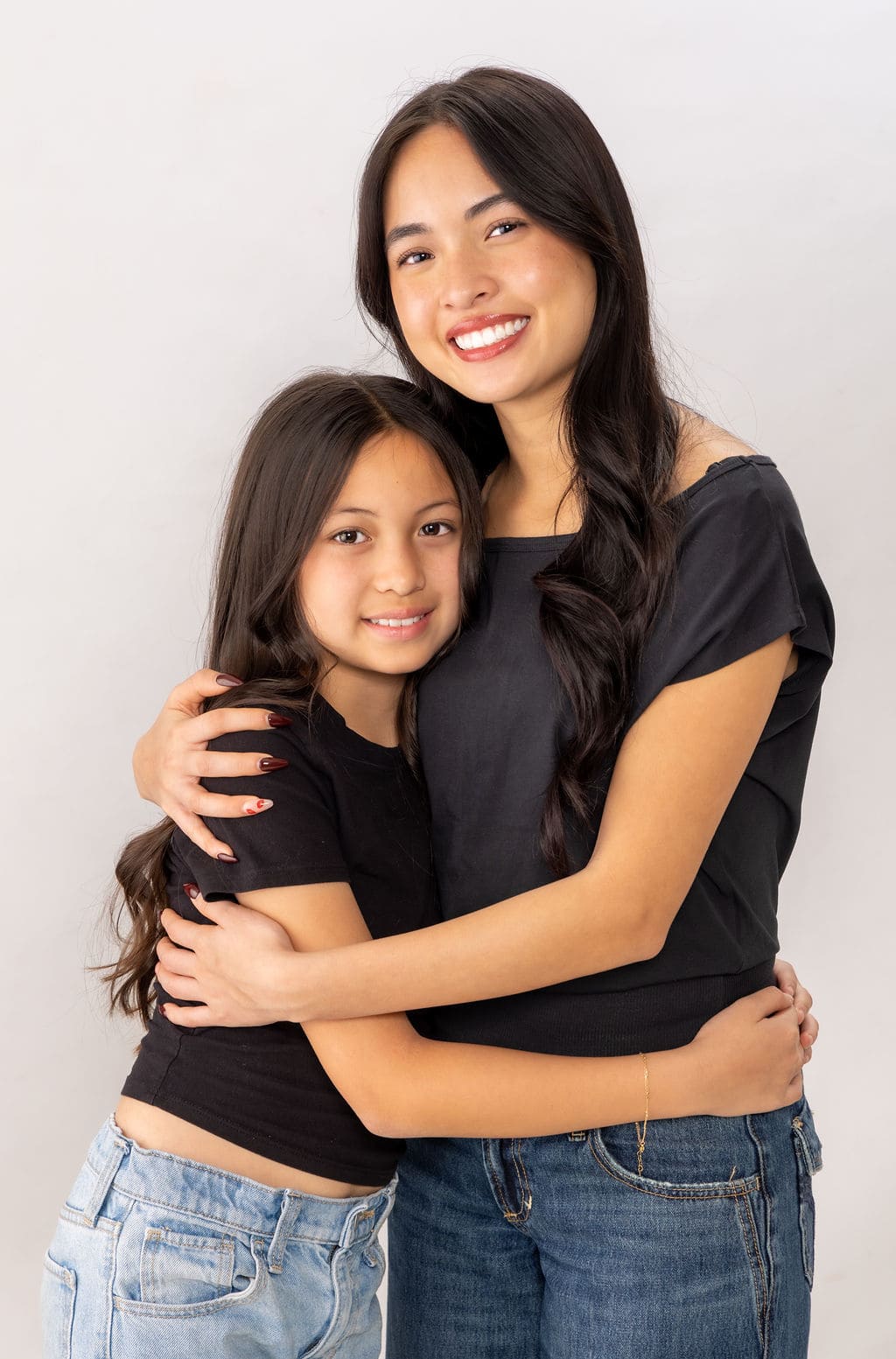 Mother and daughter close-up hug portrait by Brooke Lazzarini