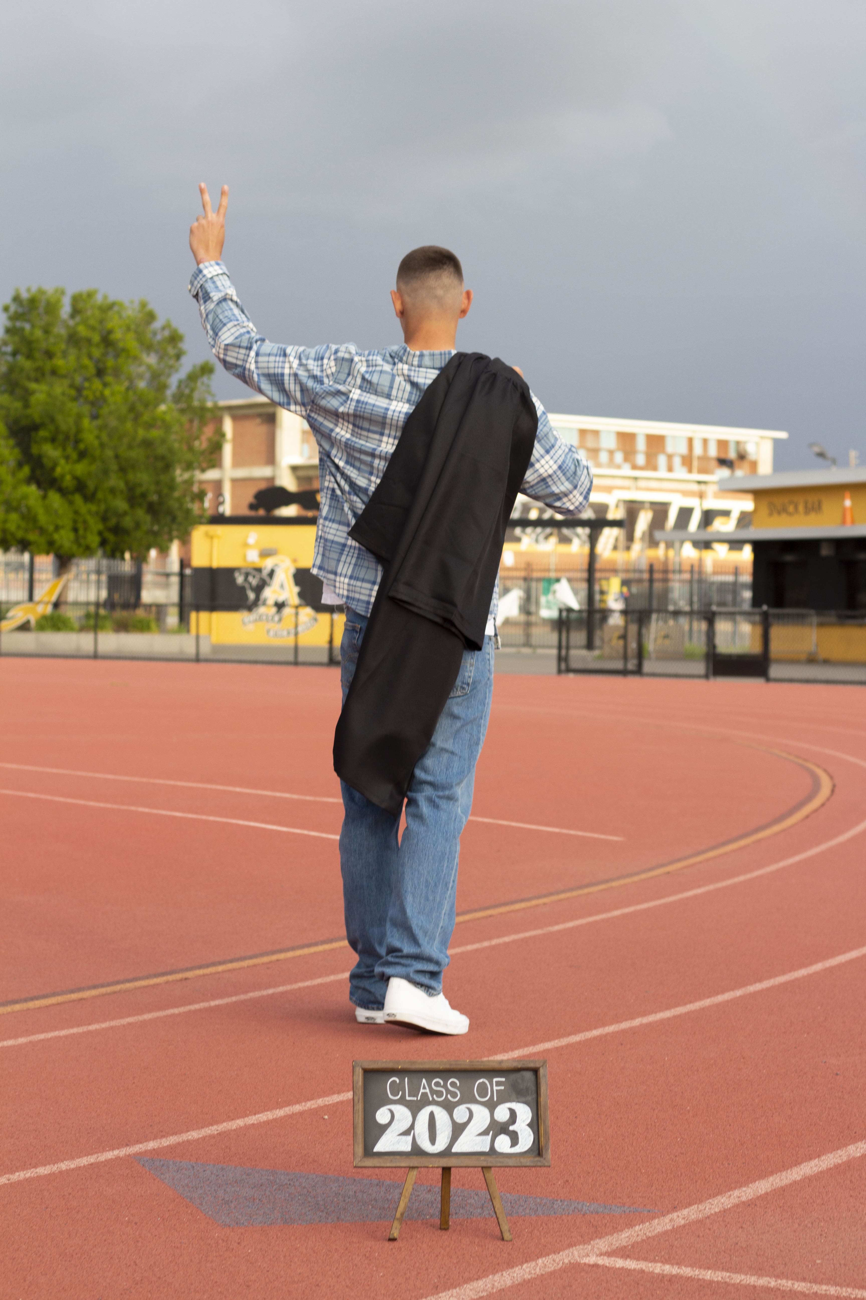 Class of 2023 senior walking away by Brooke Lazzarini