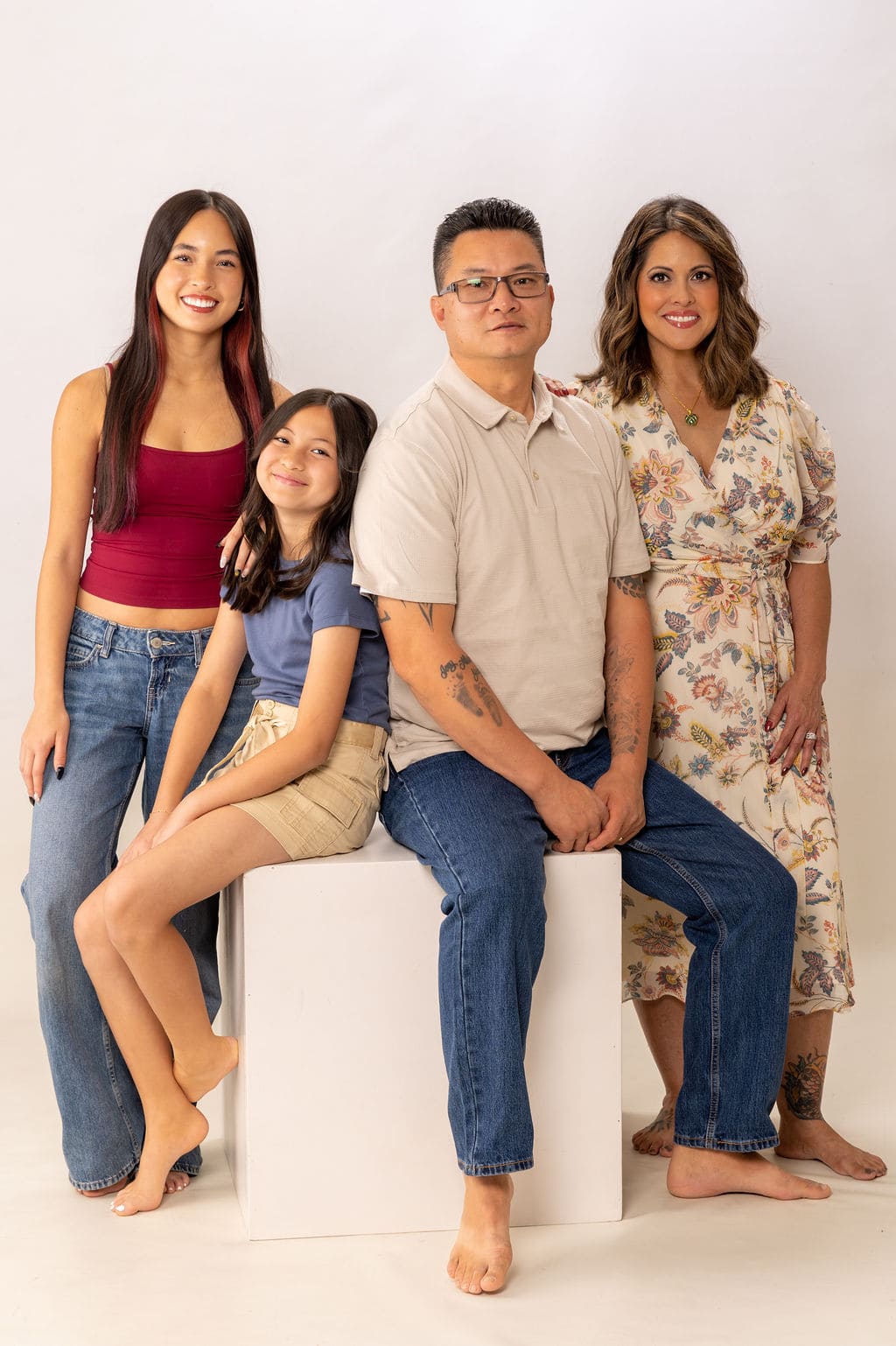 Family of four seated portrait by Brooke Lazzarini