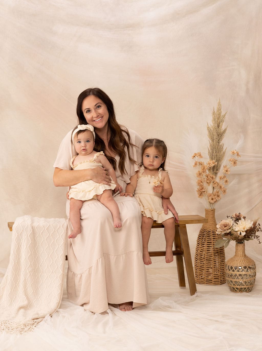 Mother with daughters portrait by Brooke Lazzarini
