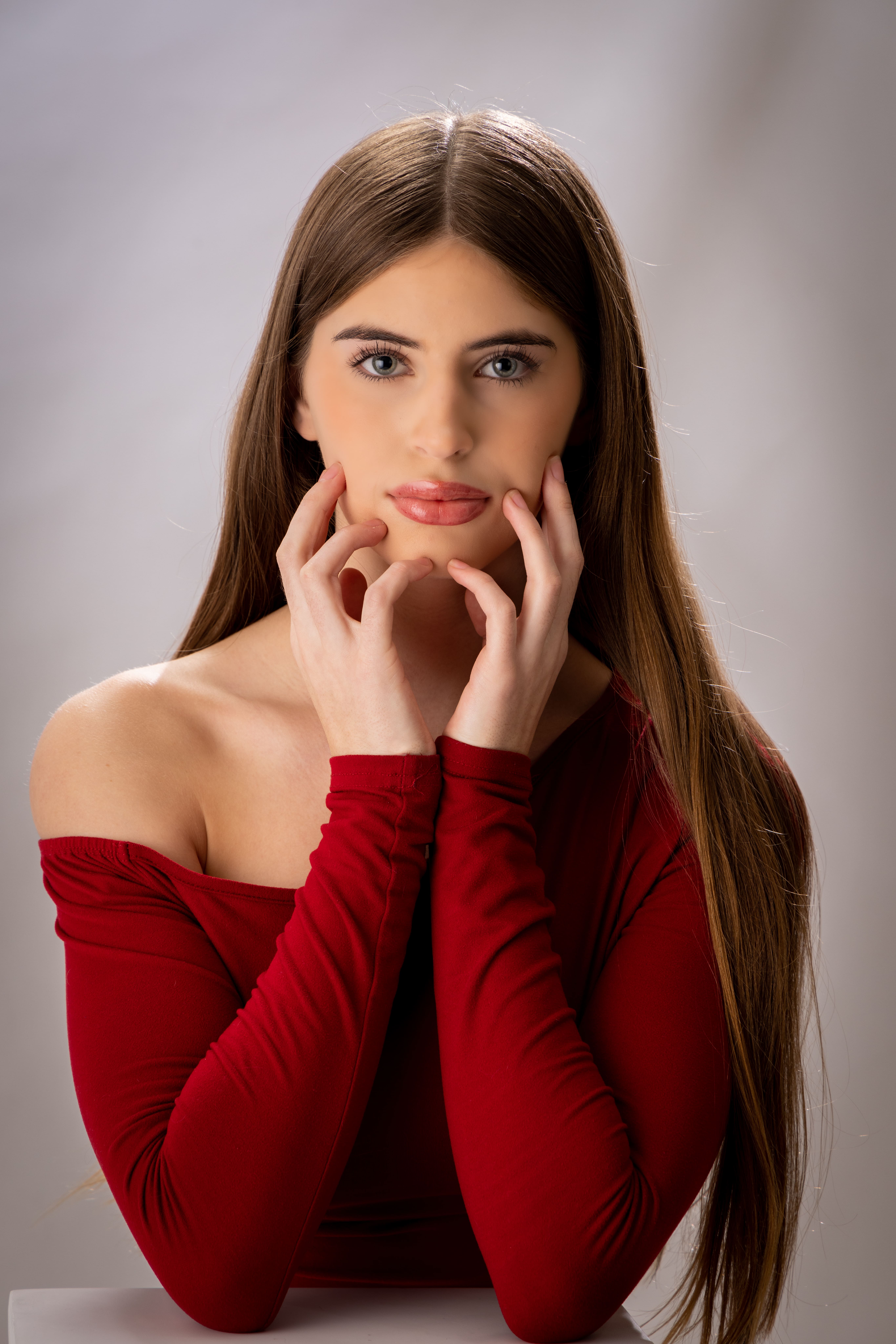 Portrait of girl in red off-shoulder top by Brooke Lazzarini