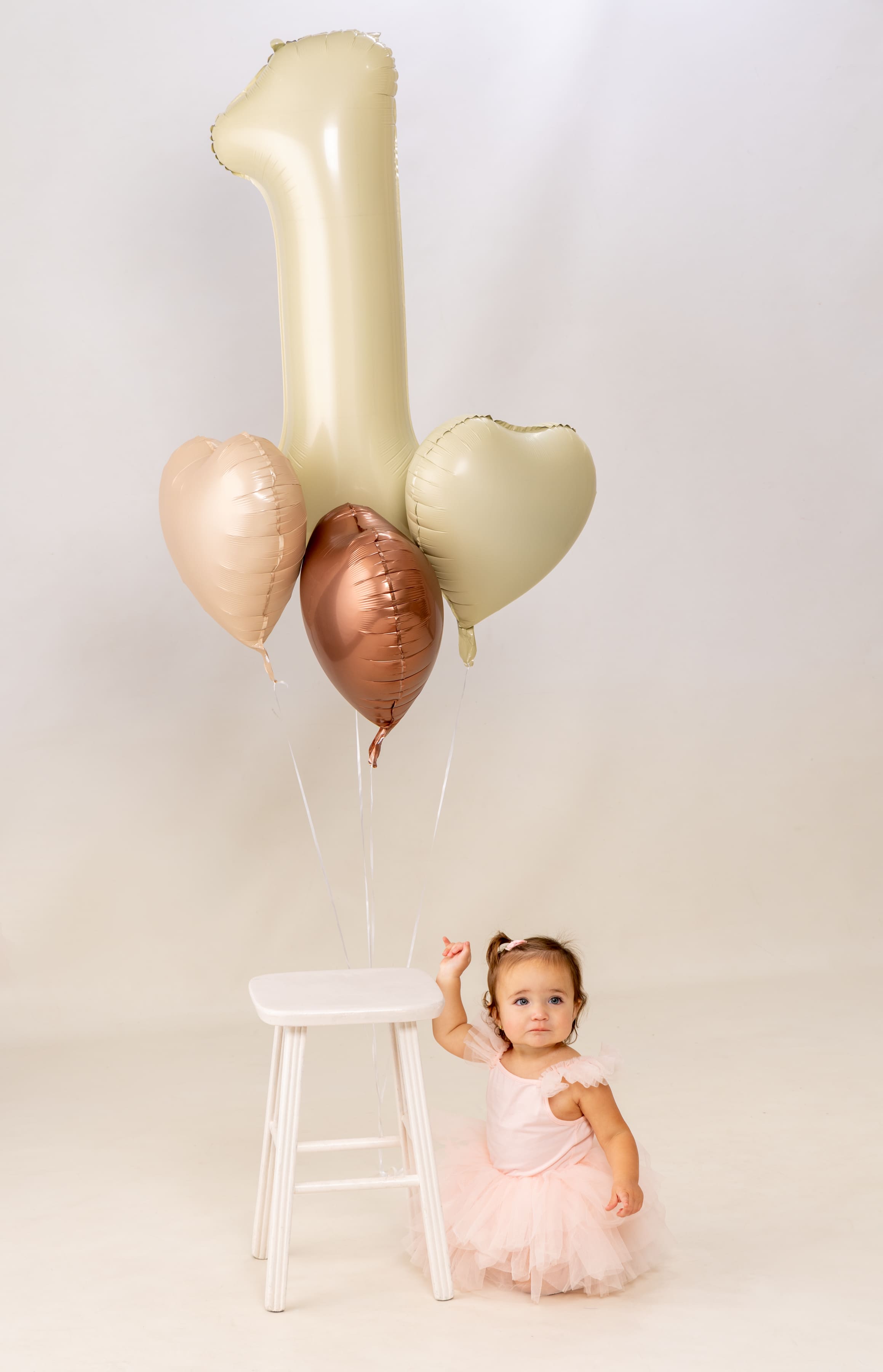 First birthday with balloons by Brooke Lazzarini