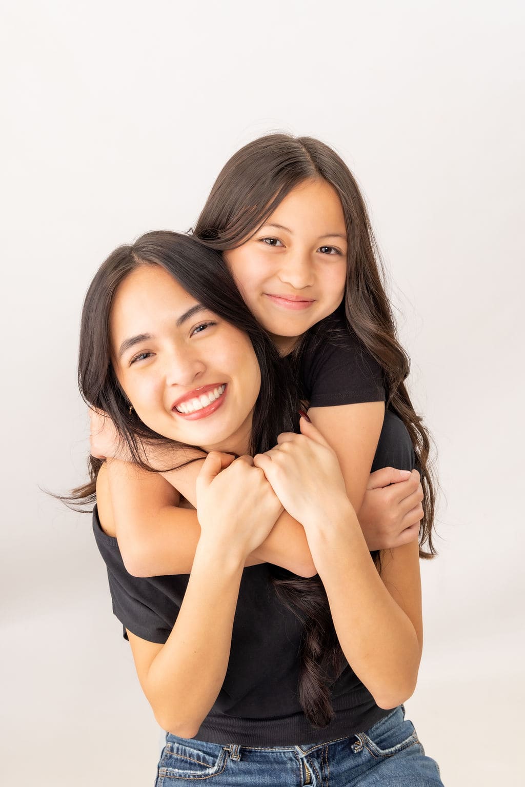 Mother and daughter embracing portrait by Brooke Lazzarini