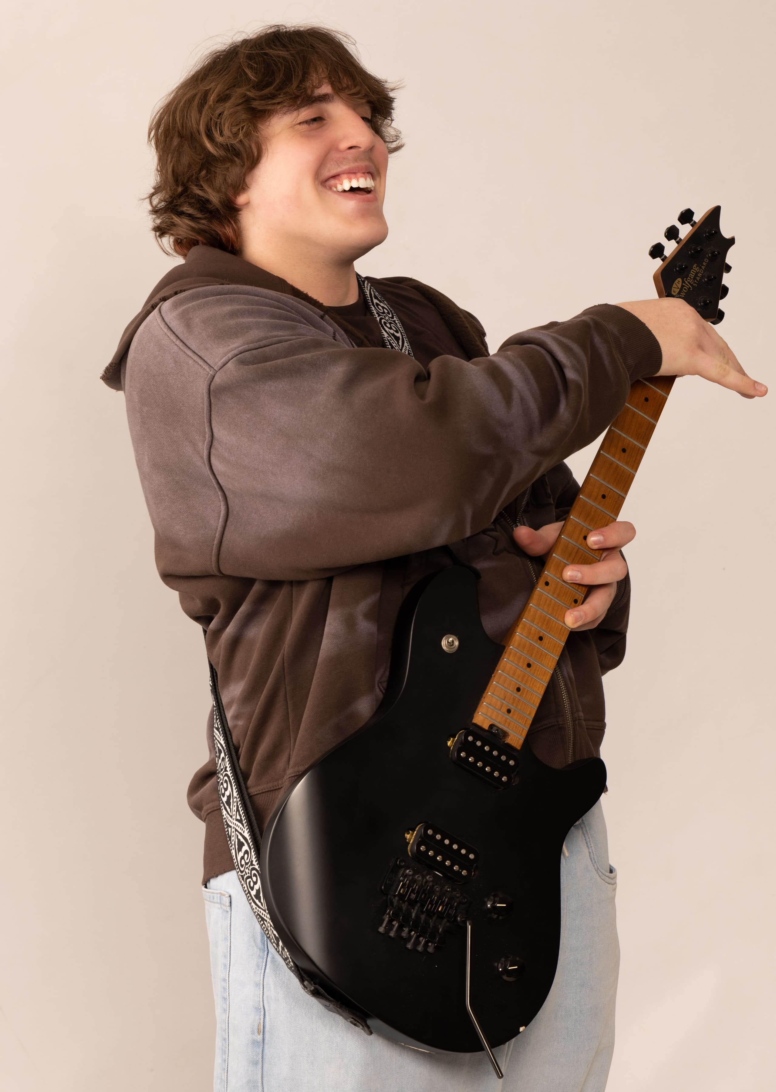 Senior with electric guitar portrait by Brooke Lazzarini