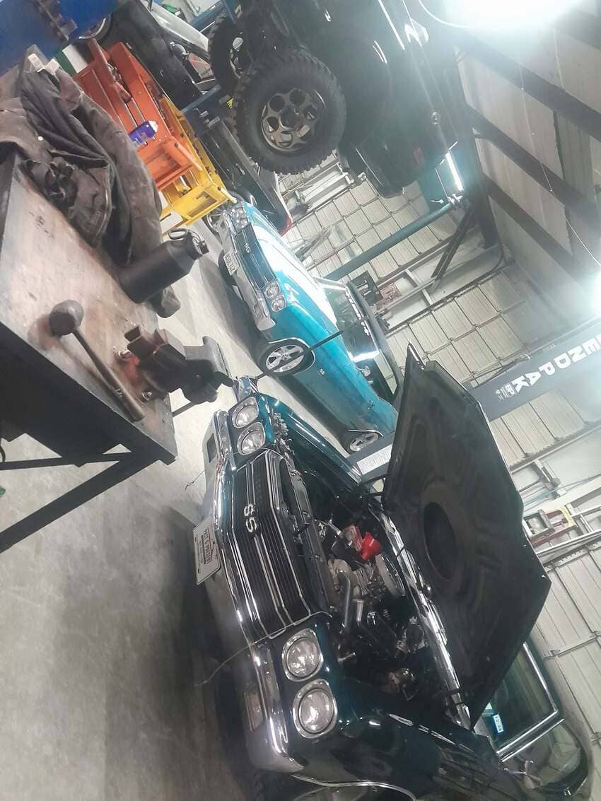 Classic car engine bay work being performed by our technicians