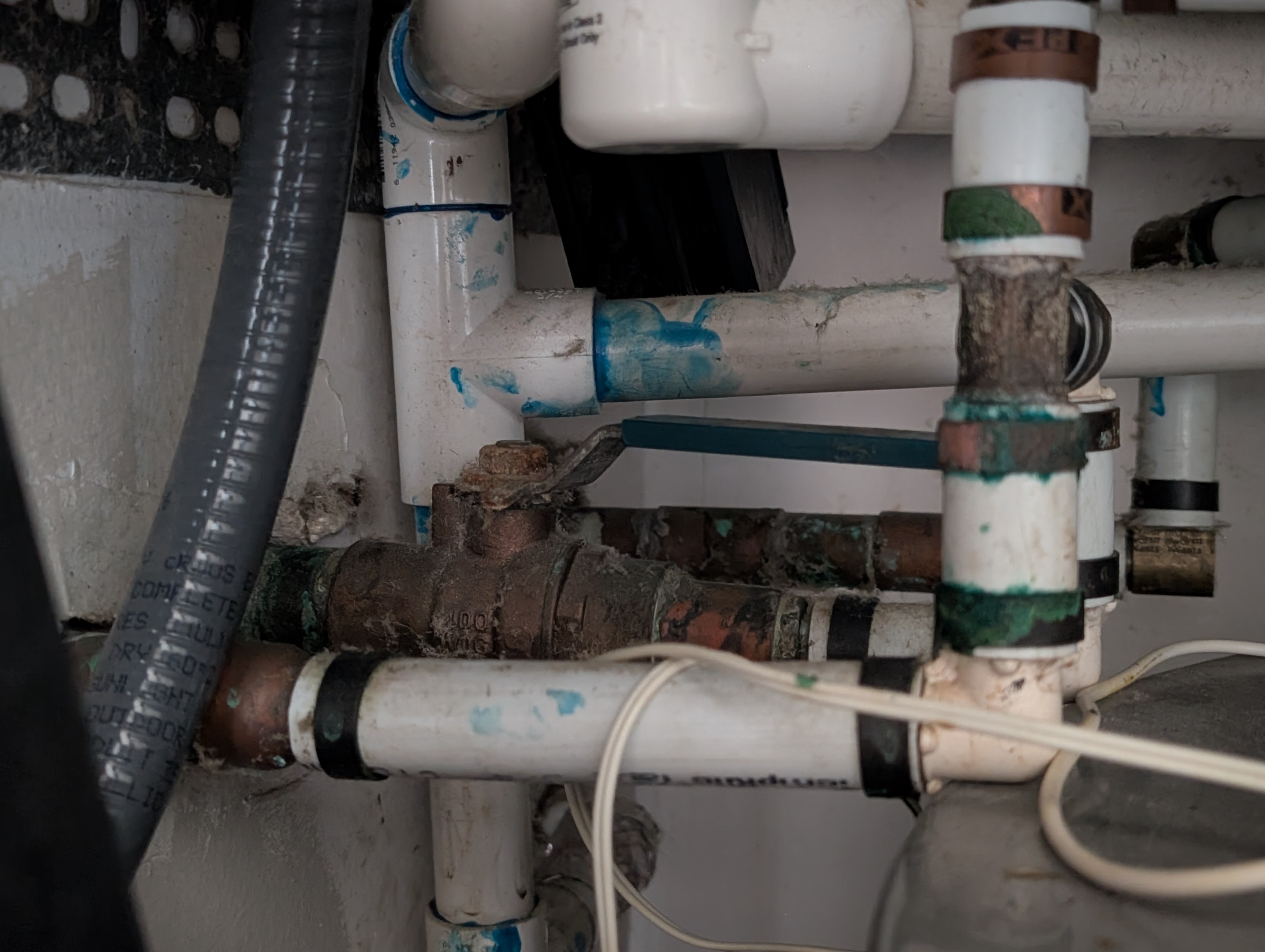 Water main shutoff valve inside utility closet
