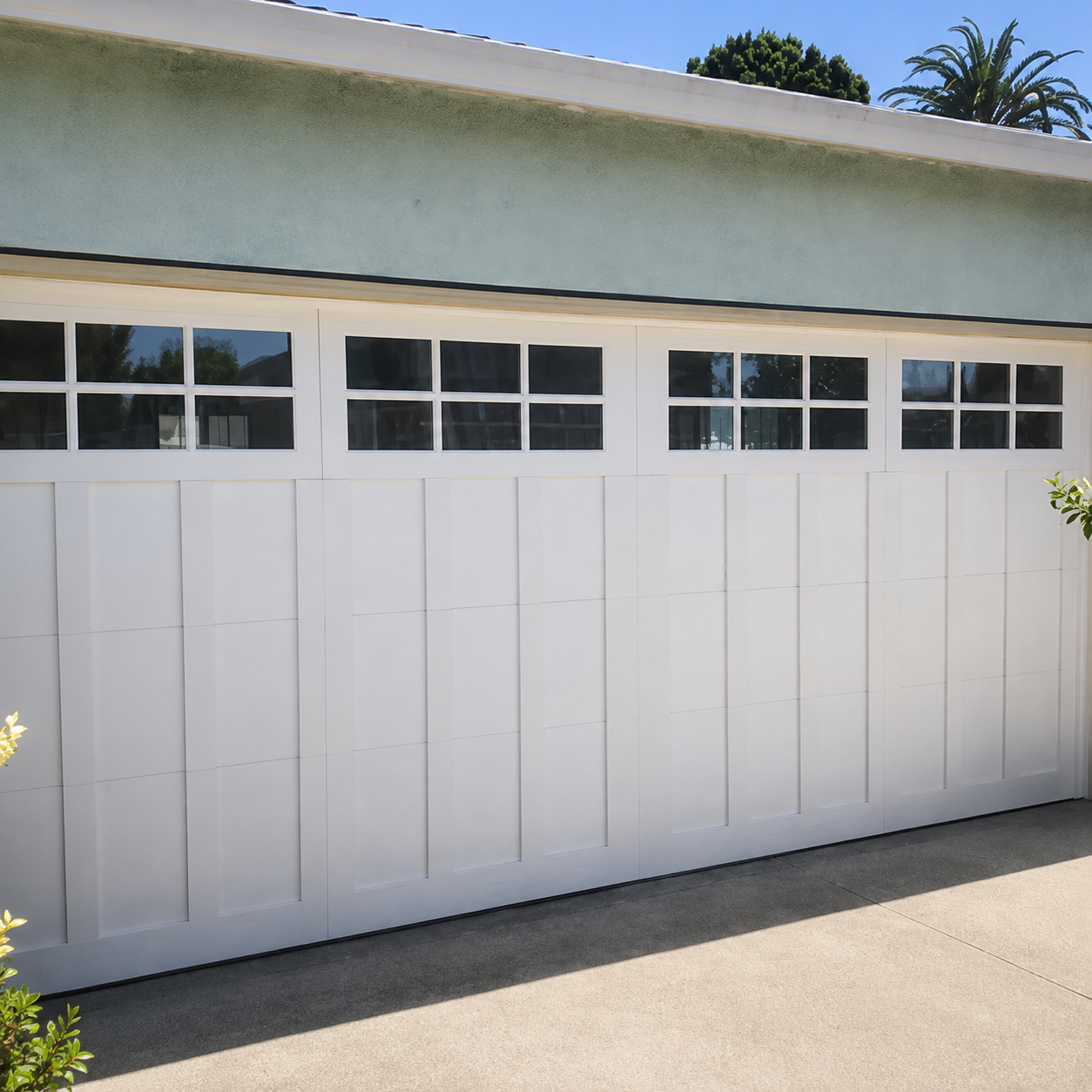 White carriage-style garage door on Craftsman home installed by JT Garage Doors in Santa Clara