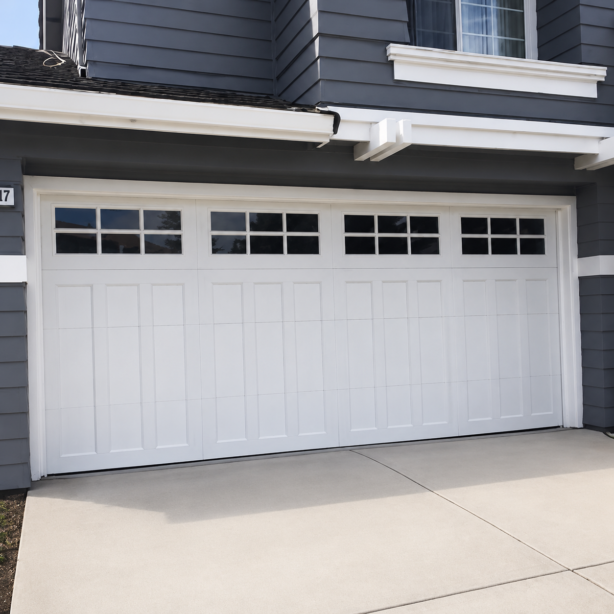 Modern white garage door with asymmetric side window design installed by JT Garage Doors in San Mateo