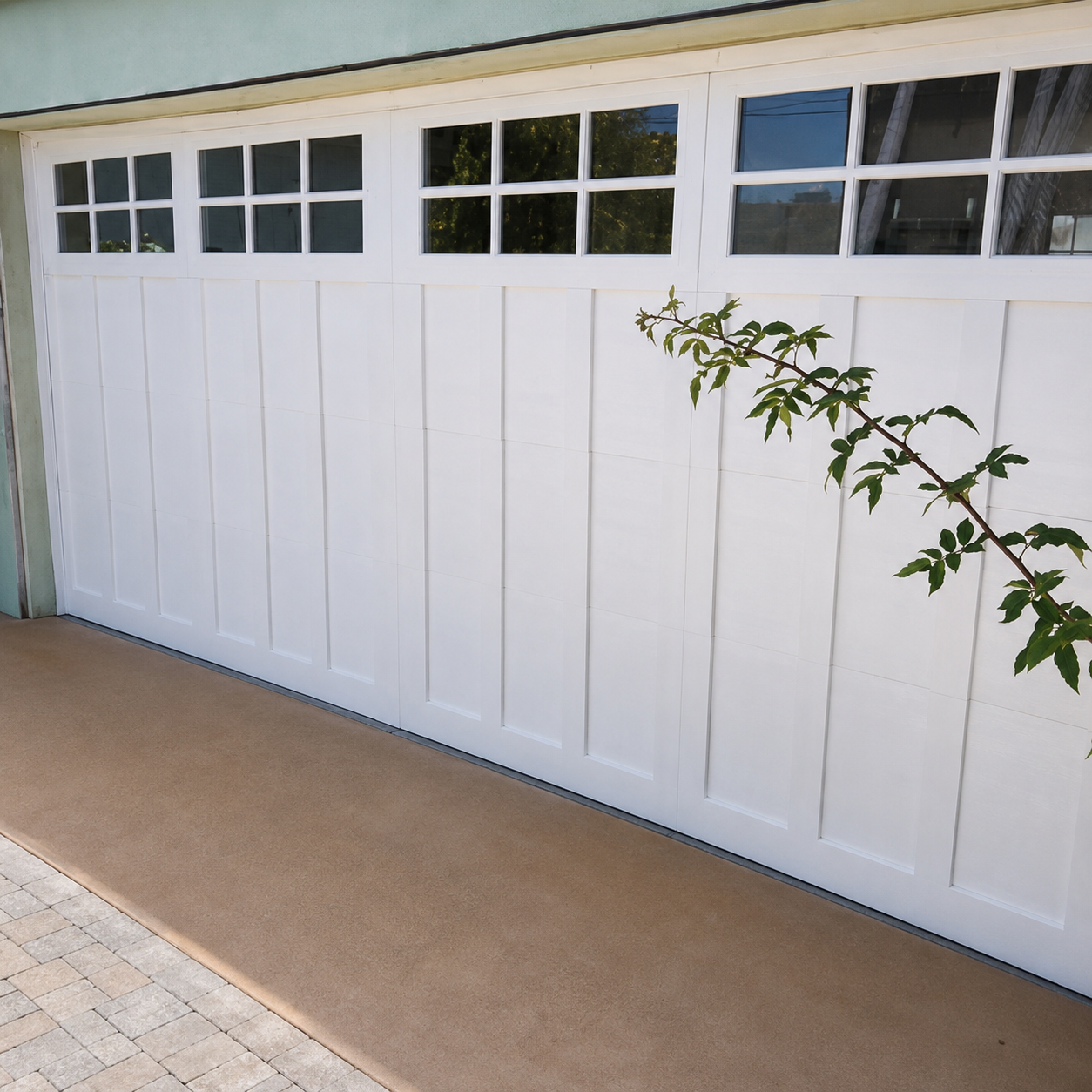 Custom white carriage-style garage door with vine detail installed by JT Garage Doors in Palo Alto