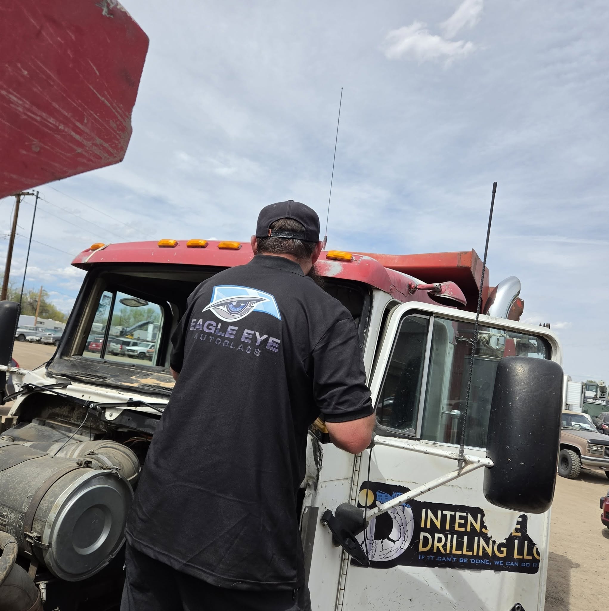 Eagle Eye Autoglass technician working on semi truck windshield