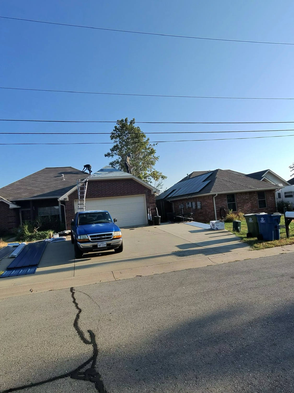 Roofing Glory crew performing an on-roof assessment in North Texas