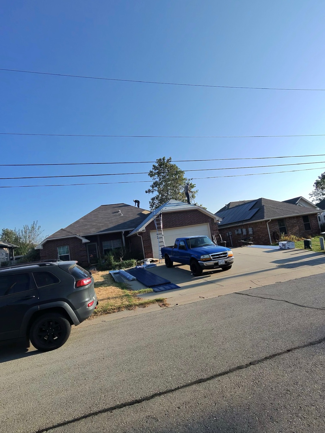 Roofing Glory crew replacing a roof in North Texas