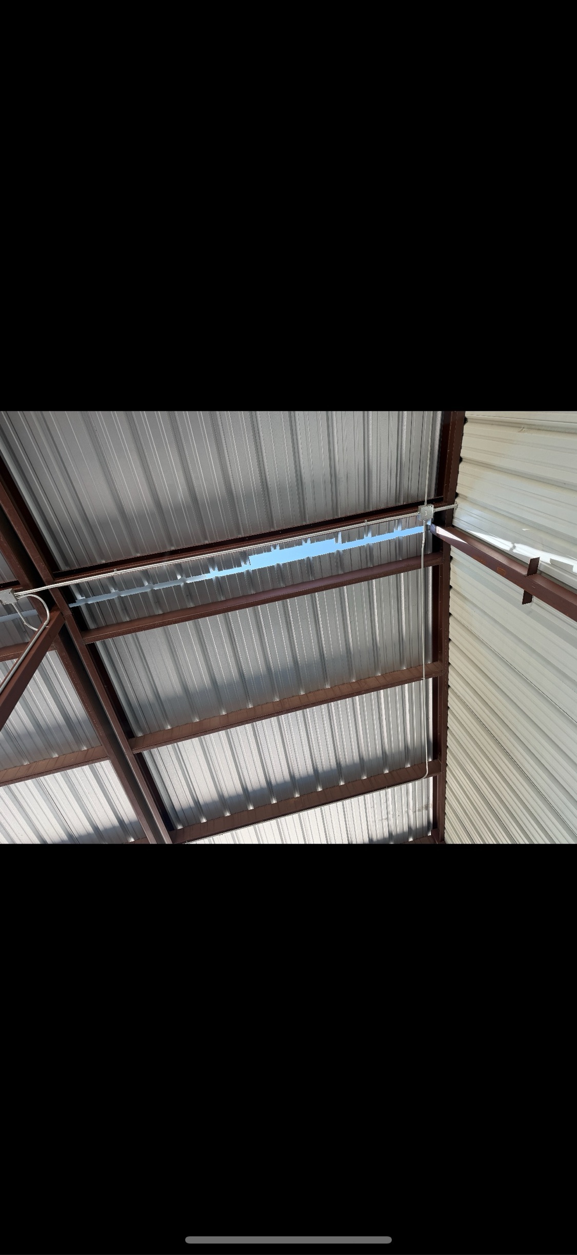 Inside a DFW commercial metal building — the structure a commercial roof system protects.