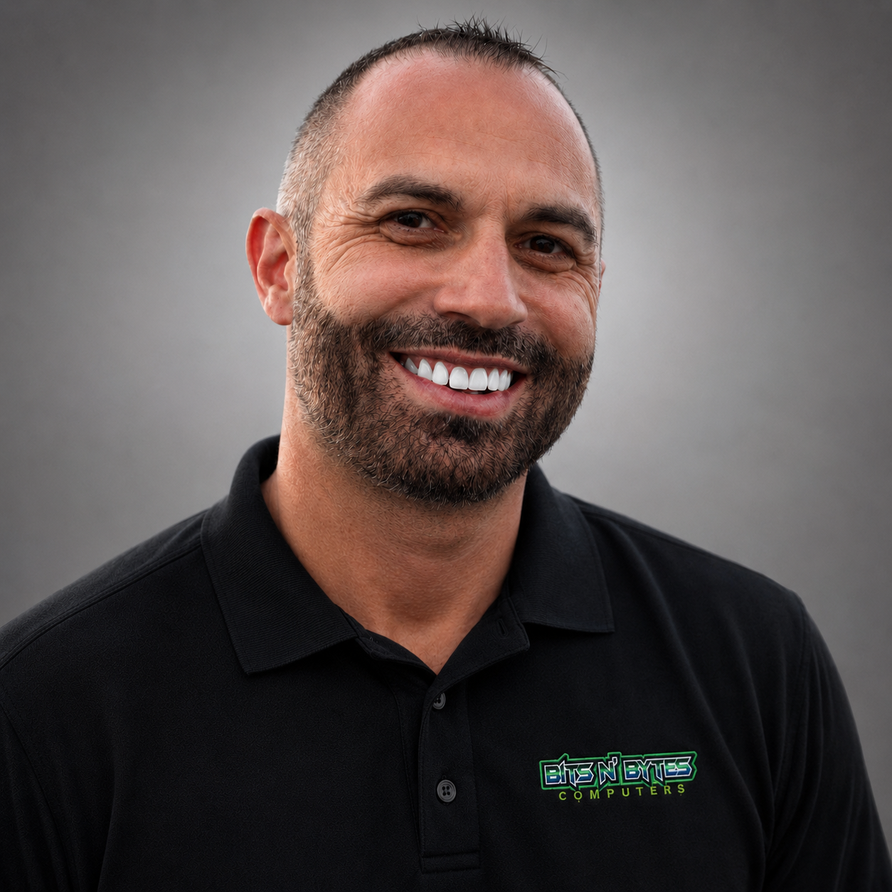 TJ, founder, wearing Bits n' Bytes Computers polo shirt