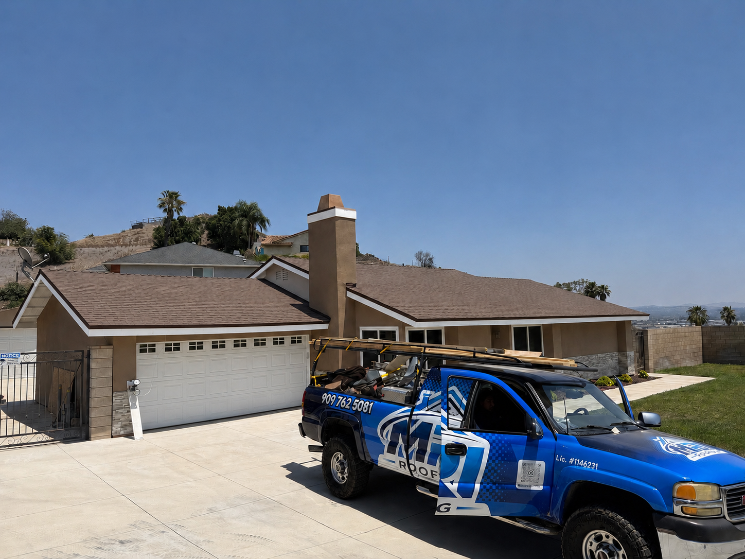 MRI Roofing Inc truck at completed residential roofing project in Southern California